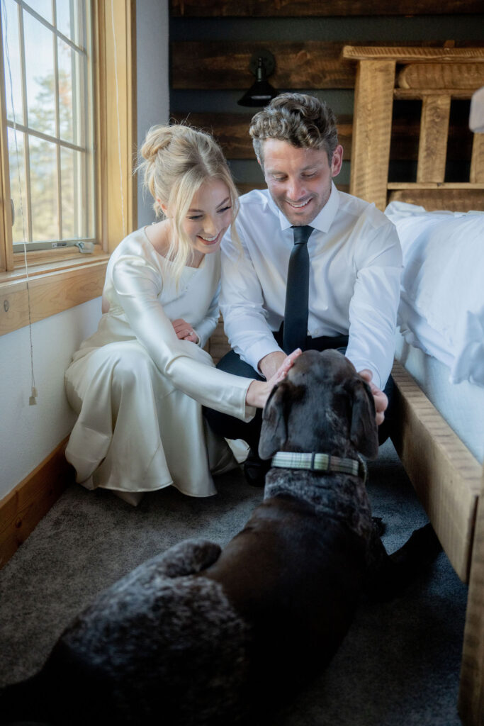 Dog lounging beside couple