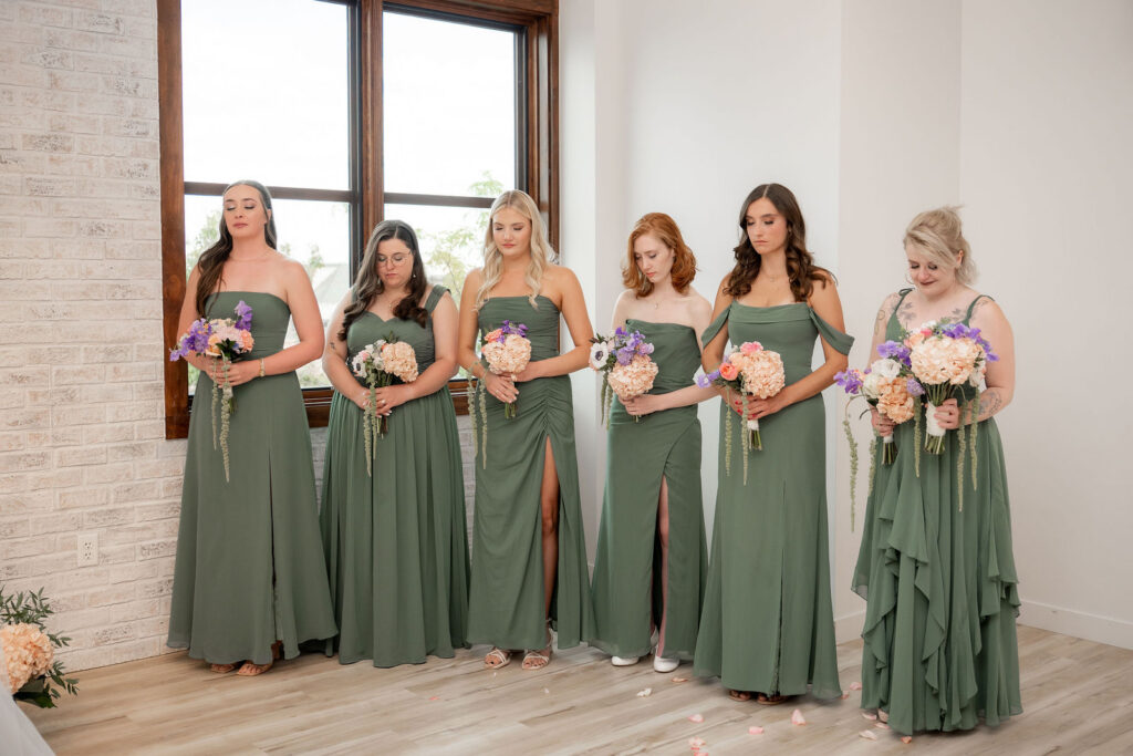 Bridesmaids wore elegant green dresses