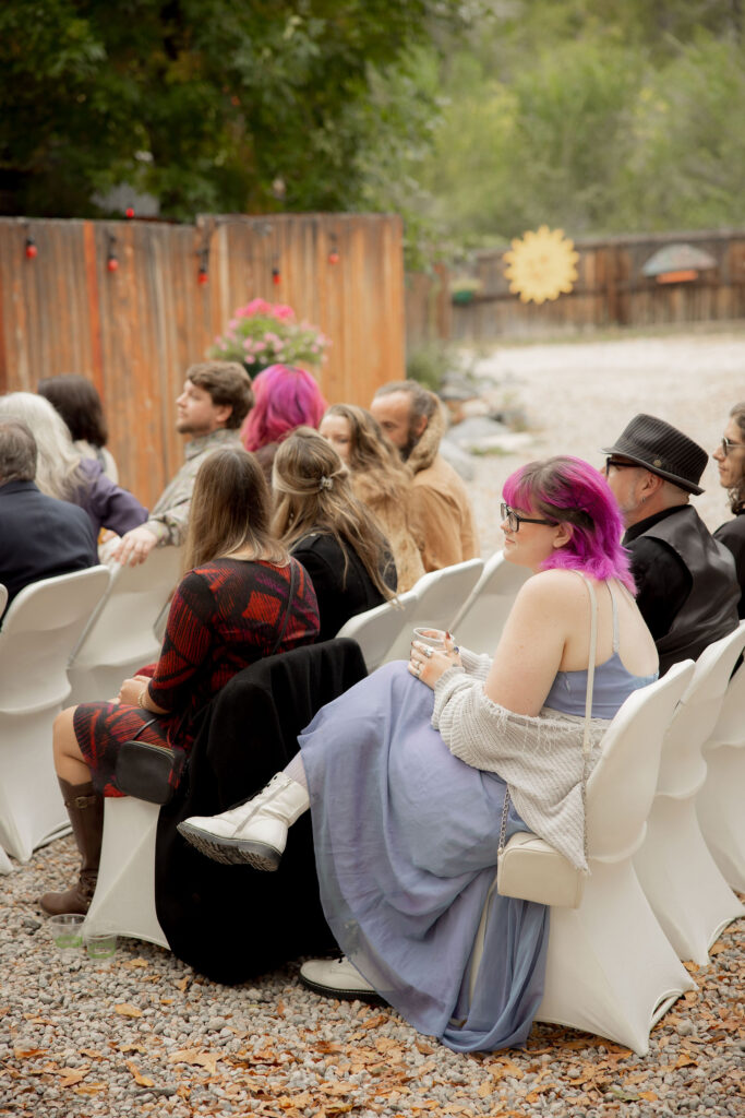 Guests seated along a gravel aisle
