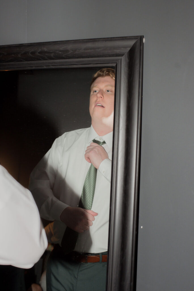 Ryan adjusting his tie