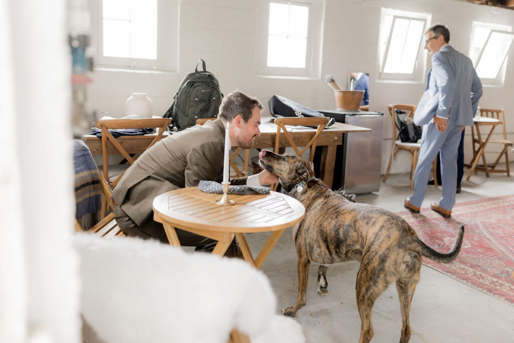 Spencer gently petting his dog