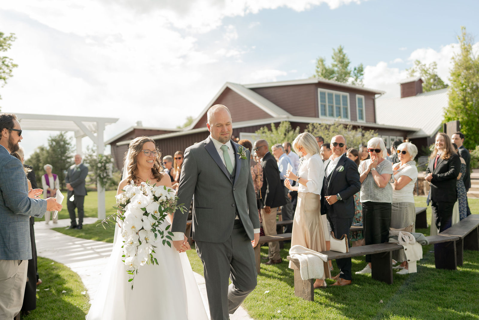 Couple walking back the aisle after officially wedded